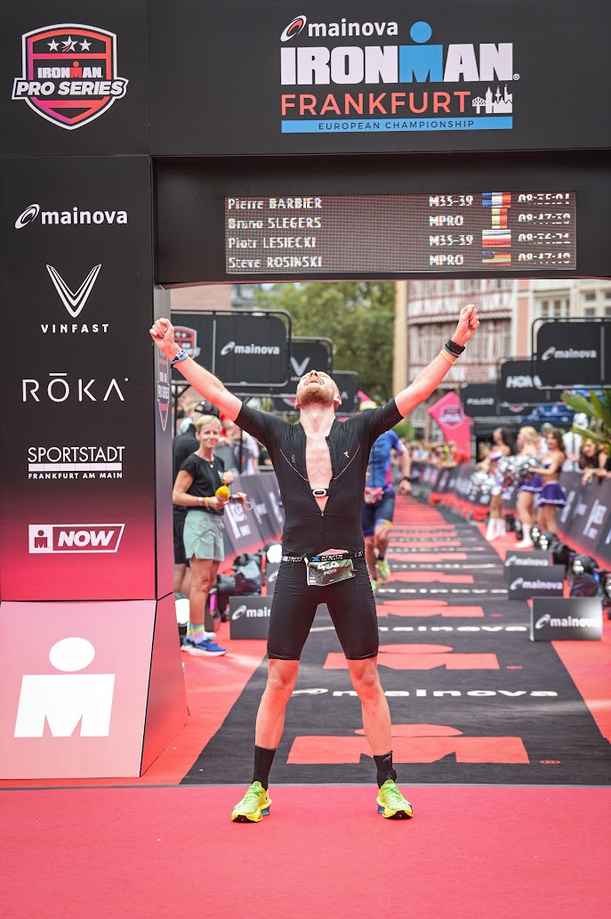 Piotr Lesiecki crossing the Ironman European Championship finish line in Frankfurt